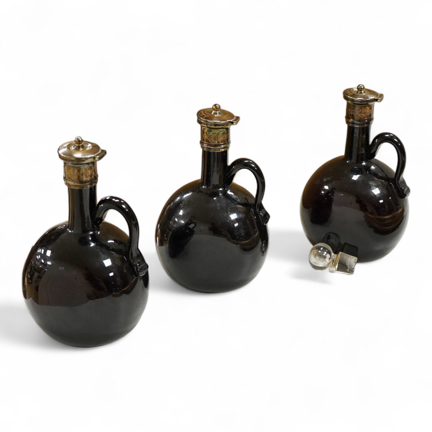 Three Victorian silver mounted glass spirit flasks, engraved 'Brandy', 'Whisky' and 'Gin', Atkin Brothers, Sheffield, 1874, 20.7cm.